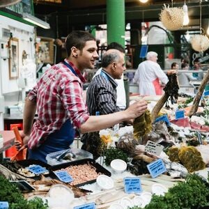 Two men at a food market stall